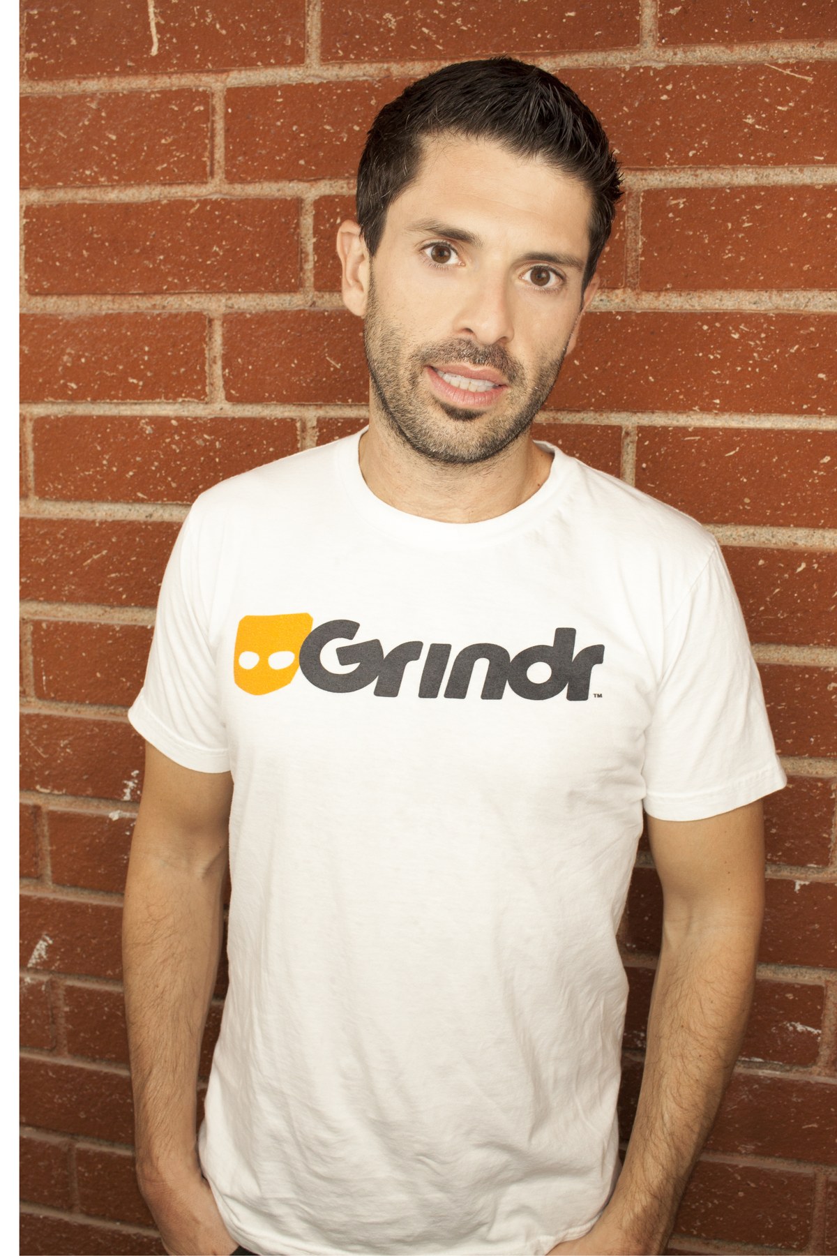 Joel Simkhai, founder of Grindr, in a Grindr T-shirt. Photo courtesy Grindr via Fortune, 2014.
